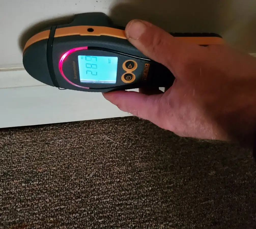 Moisture detection at baseboard during Storm Damage Restoration in Machesney Park